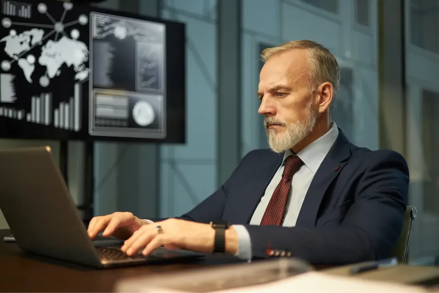 A man typing on a computer.